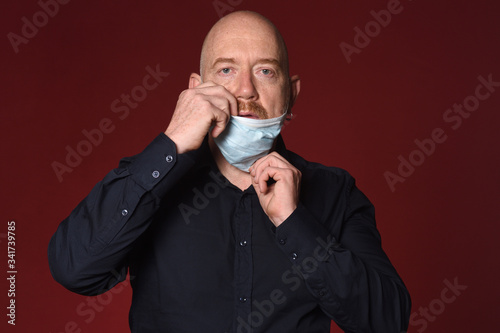 man who takes off the medical mask badly