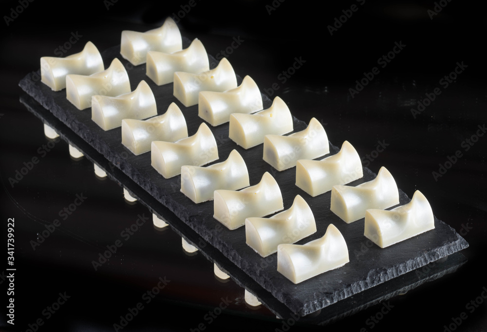 chocolate candies on black stone chocolate candies on black stone