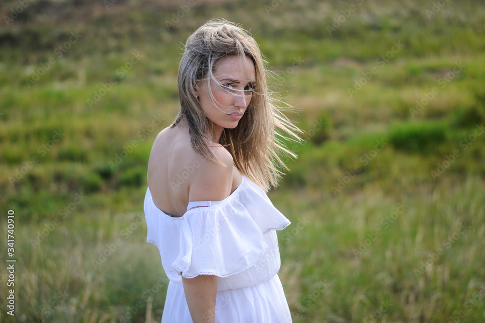 portrait of a beautiful girl of a blouse of Slavic origin. Beautiful blonde girl in a field on a hot summer day. portrait of a beautiful girl of a blouse of Slavic origin. Beautiful blonde girl in a field on a hot summer day.