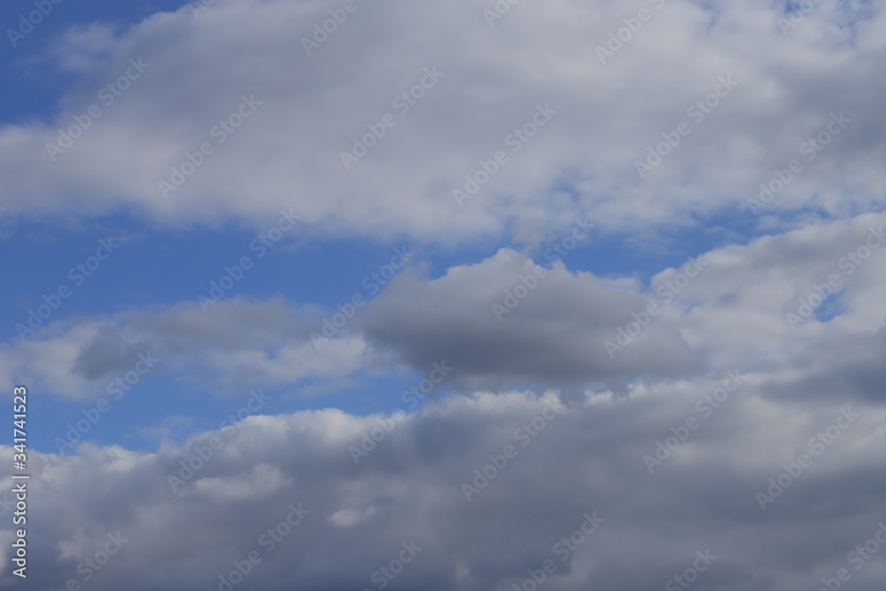 Fluffy clouds of the spring sky. Cold sky with clouds. Fluffy clouds of the spring sky. Cold sky with clouds.