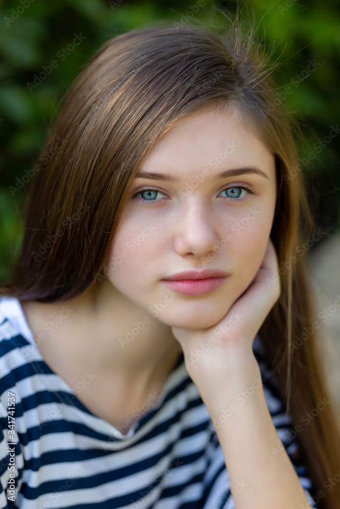 Beautiful teen girl in a marine striped shirt Beautiful teen girl in a marine striped shirt