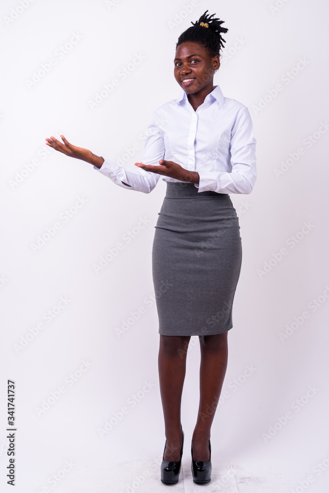 Full body shot of young beautiful African businesswoman Full body shot of young beautiful African businesswoman