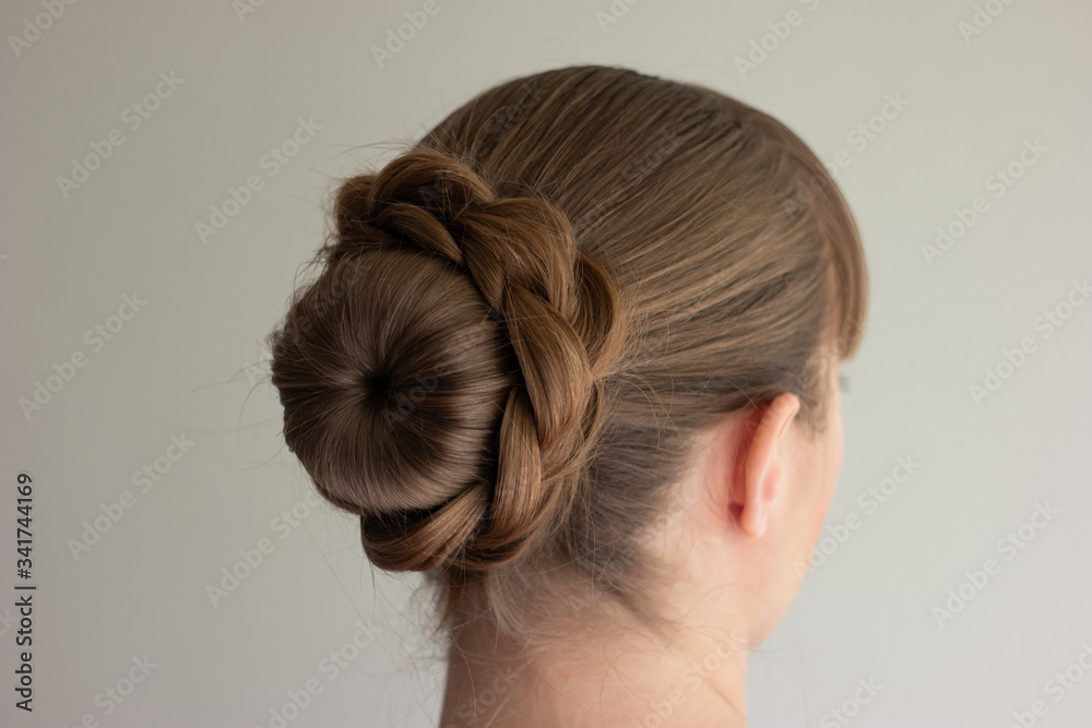 Young Caucasian woman with blonde hair wearing a self-made french bun back  side view no face unrecognizable Stock Photo | Adobe Stock