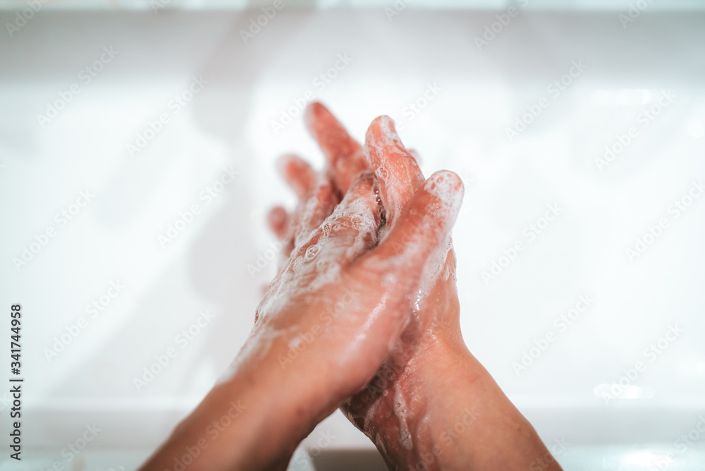 soaped hands while washing at home soaped hands while washing at home