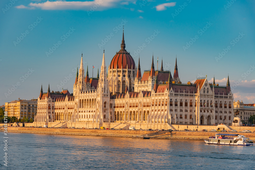sunset over the river in the city of Budapest with the Parliament sunset over the river in the city of Budapest with the Parliament
