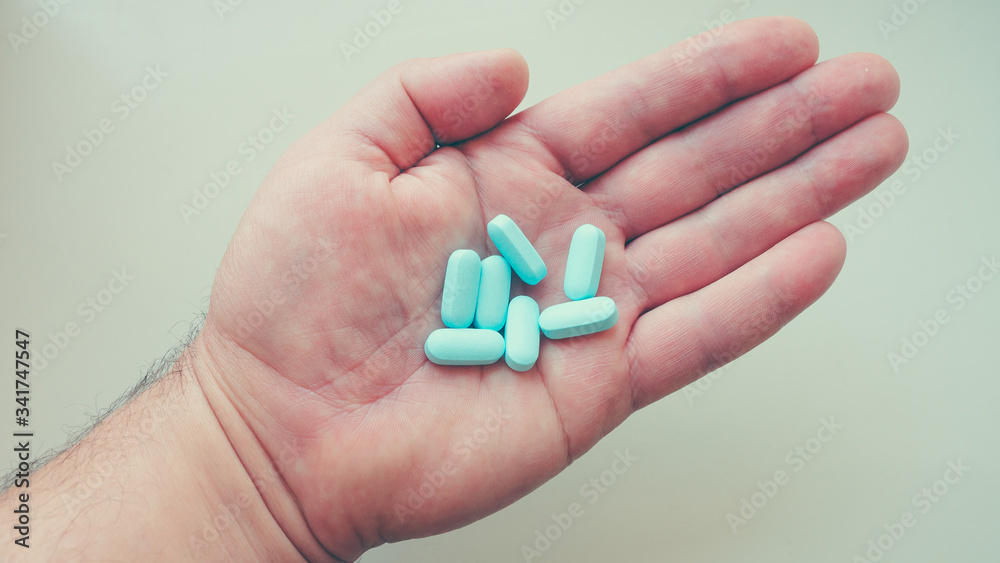 Vitamins, medicine on the palm of your hand. Different positions and colors. Vitamins, medicine on the palm of your hand. Different positions and colors.