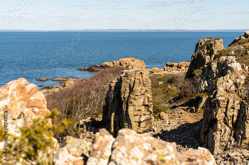 Hovs Hallar Nature Reserve with rocky landscape ends abruptly by the sea and is a very popular tourist attraction. Located 10 km away from Torekov and 14 km from Bastad in Sweden. photo