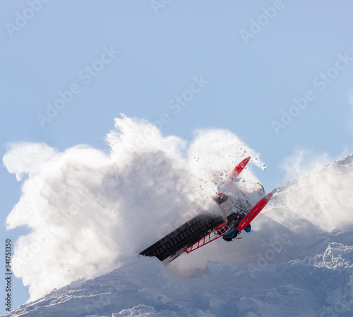 snowmobilers sports riding. Winter extreme ski-doo. an elite snowmobiler is testing a new model of mountain snowmobile, the prototype of 2021. bright snowmobile and suit. rider makes a turn and jump
