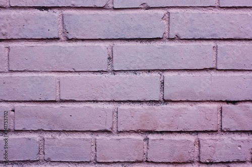 Beautiful lilac brick wall close up view