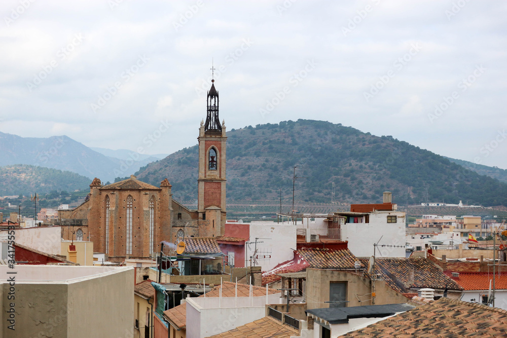 view to the roofs of the city of Sagunto, Spain with mountains on the background