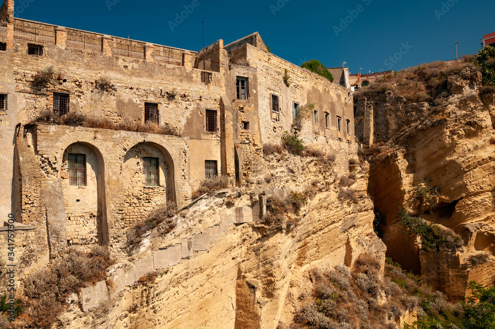 The old abandoned prison in the historic Palazzo d'Avalos on the Terra Murata cliffs, Procida Island, Italy
