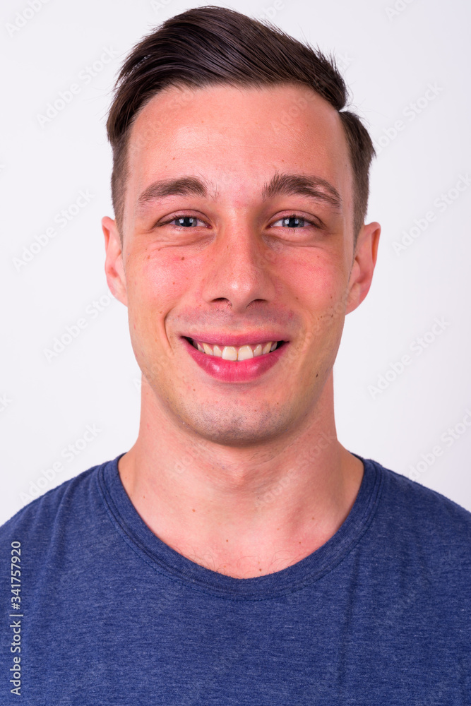 Face of happy young handsome man smiling Face of happy young handsome man smiling