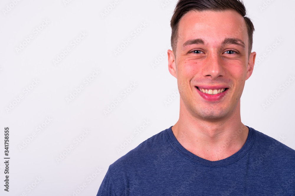 Face of happy young handsome man smiling Face of happy young handsome man smiling