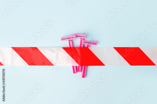 Shaving razors and stop sign on pink background, concept of skincare, delicate hair remove, beauty industry, wellness, spa salon banner, safety depilation photo