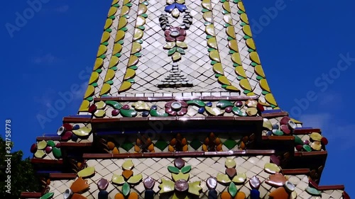 Decorated chedies inside a Buddhist temple in Bangkok, Thailand photo