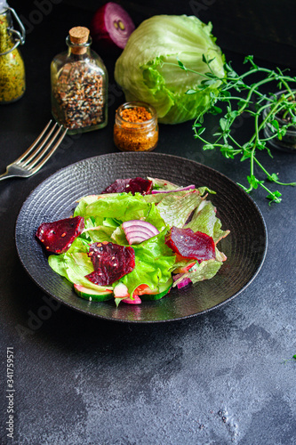 healthy salad beetroot slices, iceberg lettuce, greens. Menu concept food background, keto or paleo diet. top view. copy space for text