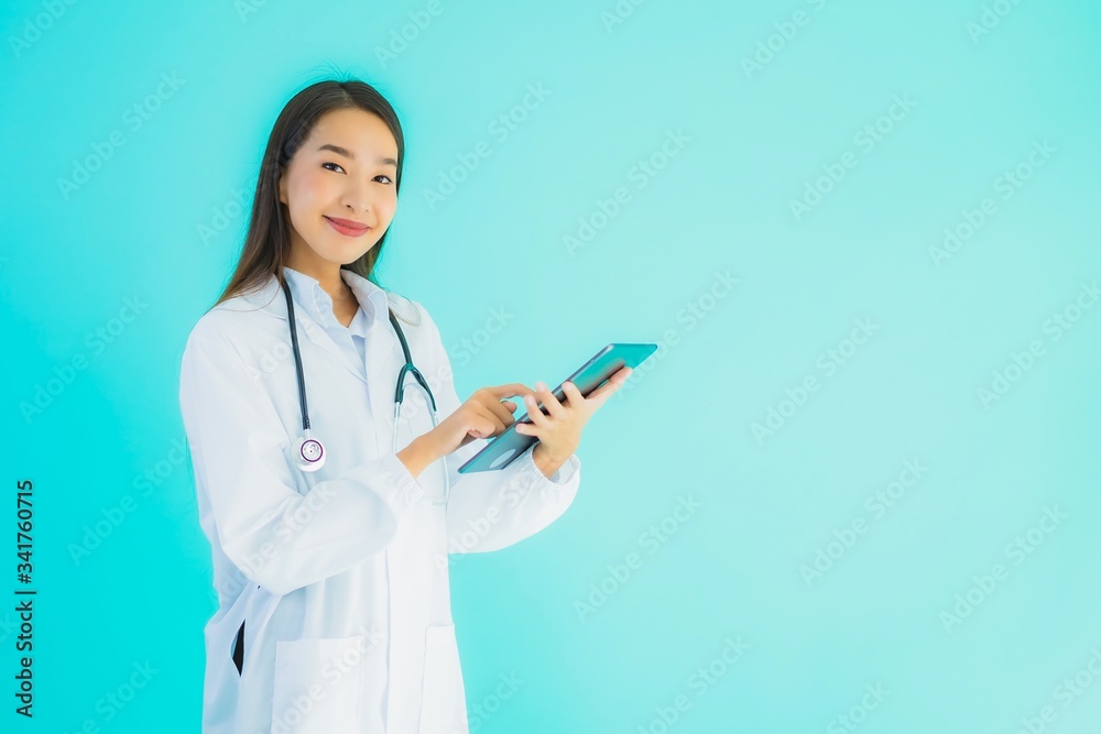 Portrait beautiful young asian doctor woman with stethoscope and smart tablet Portrait beautiful young asian doctor woman with stethoscope and smart tablet