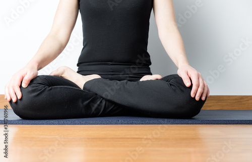 girl in black with yoga posture
