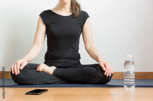 girl in black with yoga posture