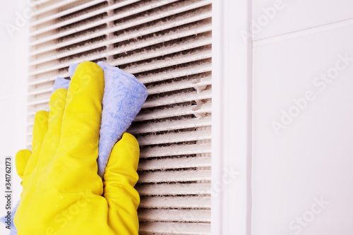 A layer of dust on the ventilation grill in the bathroom. To clean ventilation at home.