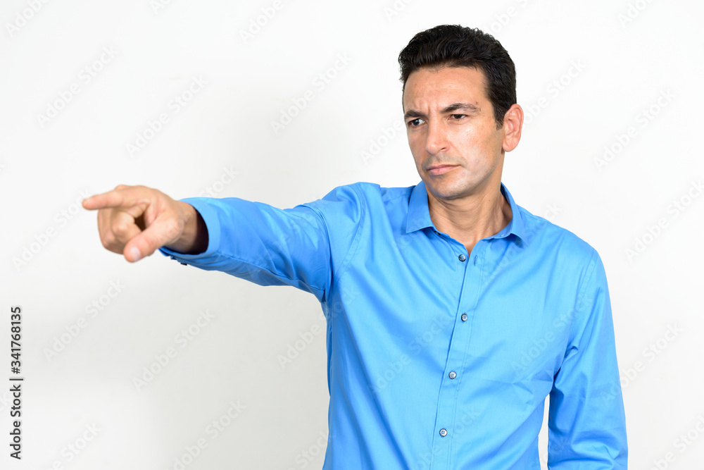 Portrait of stressed mature businessman pointing finger Portrait of stressed mature businessman pointing finger