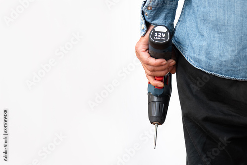 electric drill in hand,electric cordless drill,impact drill  photo