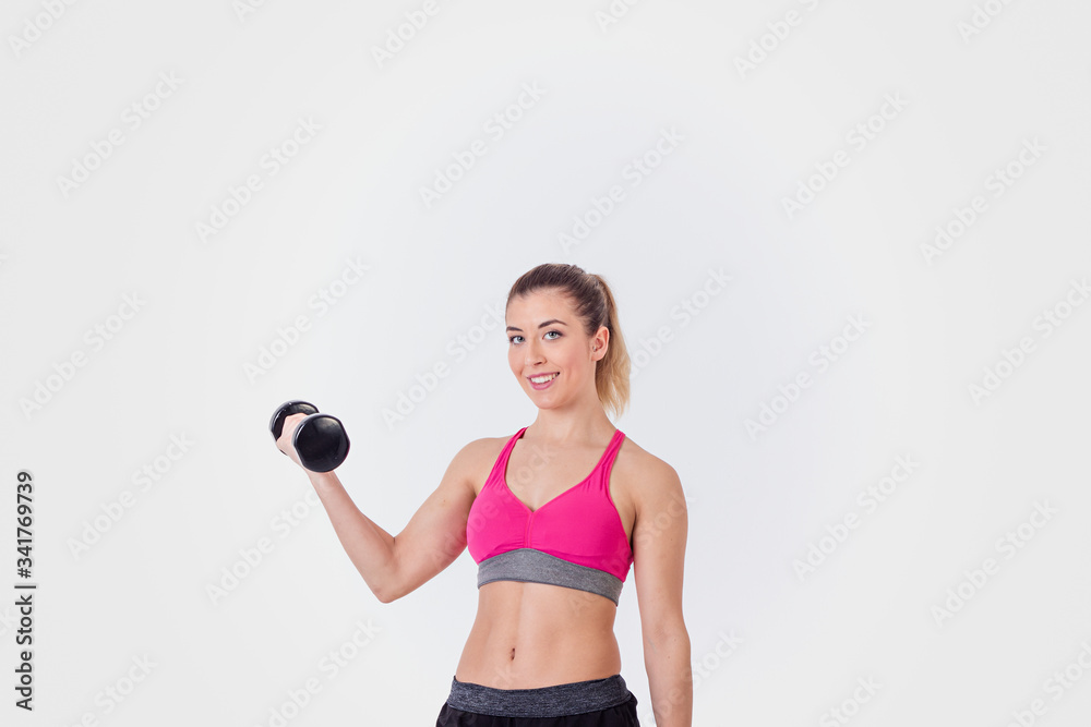 Young Fit Athletic Woman On Light Background Young Fit Athletic Woman On Light Background