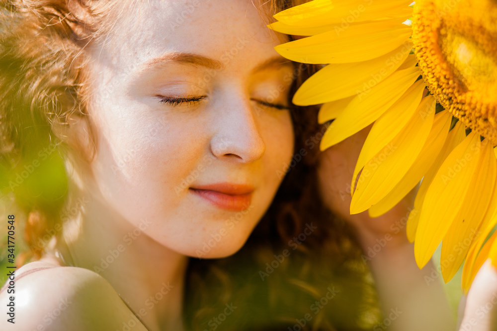 Redhair girl in sunflowers Redhair girl in sunflowers