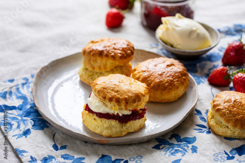 Freshly baked home made scones with strawbery jam and clotted cream