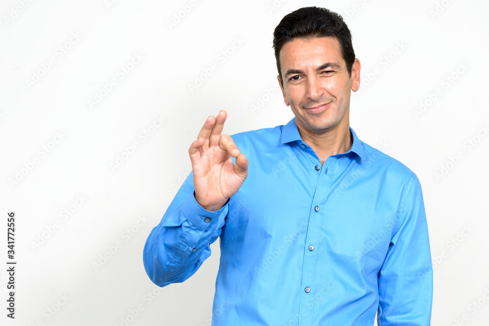 Portrait of mature handsome businessman with ok sign Portrait of mature handsome businessman with ok sign