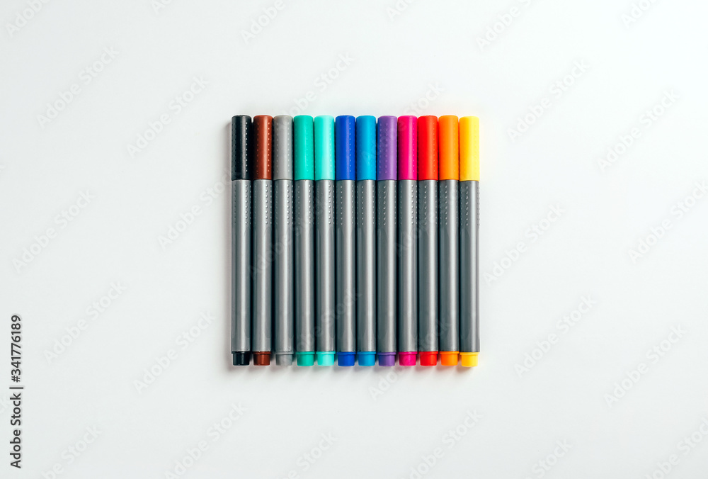 Naklejka premium Set of multicolor felt pens, markers on white background, colorful fineliners.