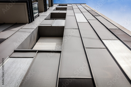 Modern building facade with grey steel and windows