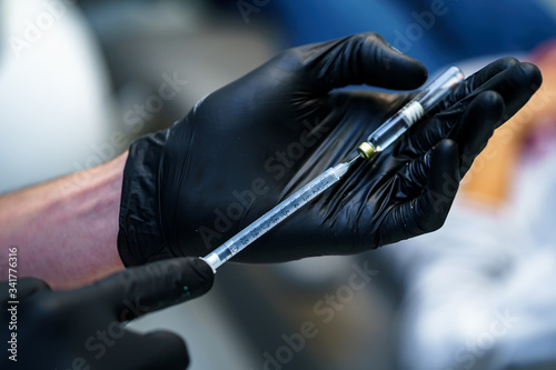 Medical syringe with needle and carpula. Concept of anesthesia, injection. © Vadim