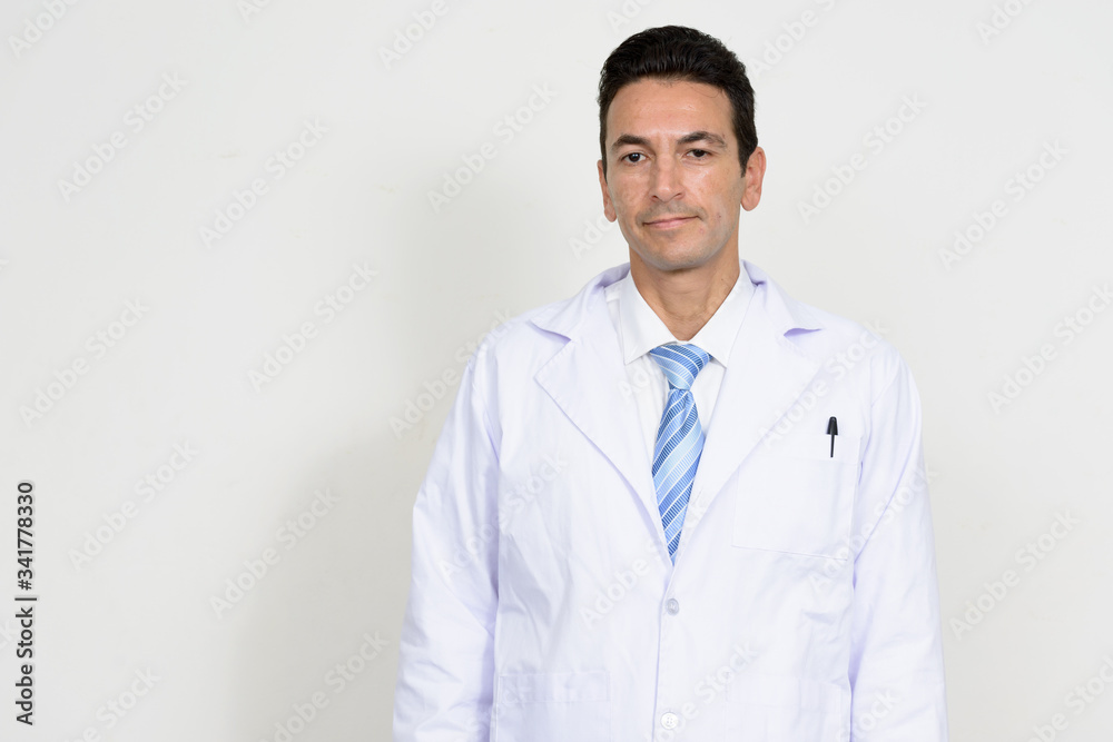 Portrait of mature handsome man doctor looking at camera Portrait of mature handsome man doctor looking at camera