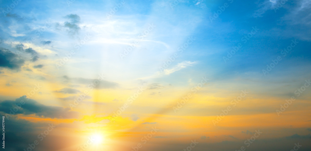Panoramic photo bright spring sunset with blue sky, red sun