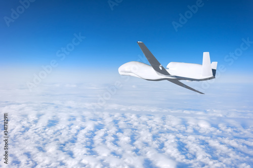 Unmanned aerial vehicle flying high in the sky above the clouds, mission. Elements of this image furnished by NASA