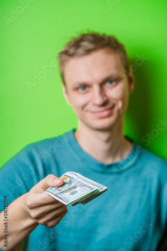 a young man with money in hand