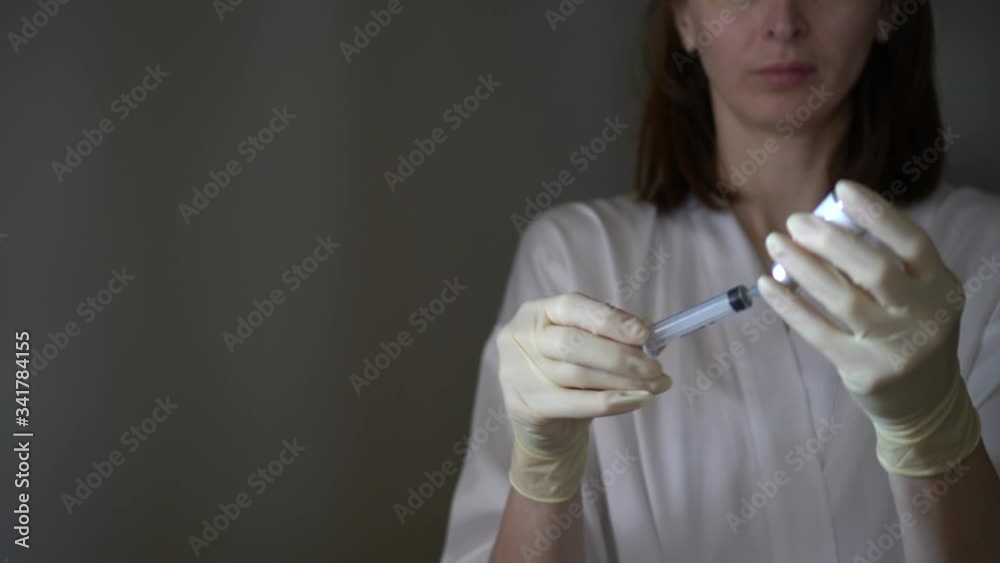 Self-injection of antibiotics. Female preparing needle for injecting her buttocks. Woman injecting buttocks. Self-injection of antibiotics. Female preparing needle for injecting her buttocks. Woman injecting buttocks.