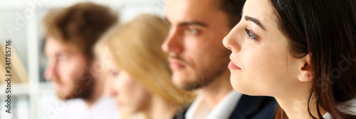 Fotografie Group of people listen carefully during seminar in office portrait