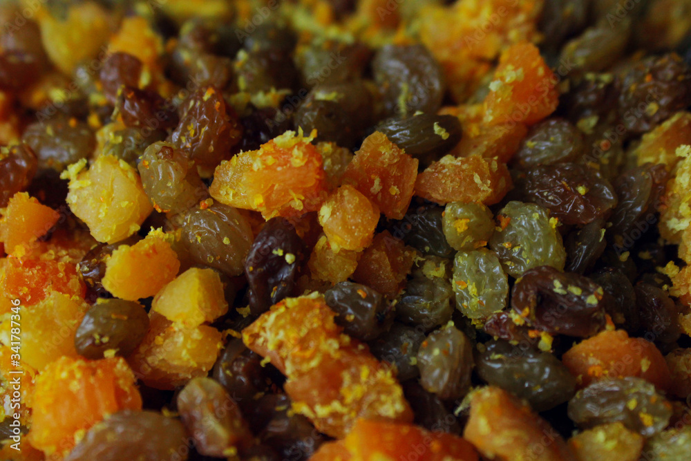 Raisins, dried apricots and candied fruits, cropped shot. Abstract food background.
Raisins, dried apricots and candied fruits, cropped shot. Abstract food background.