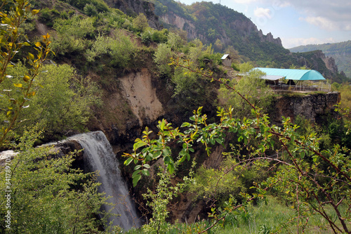 Small waterfall splashes view in Arslanbob, Kyrgyzstan photo