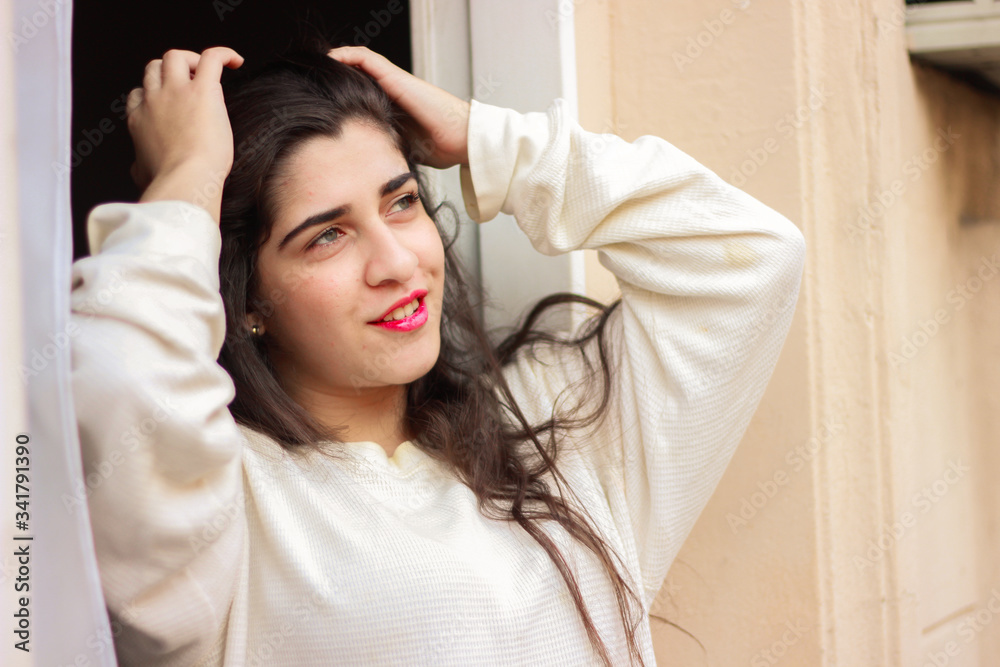 Fototapeta premium smiling woman watching the sunrise 