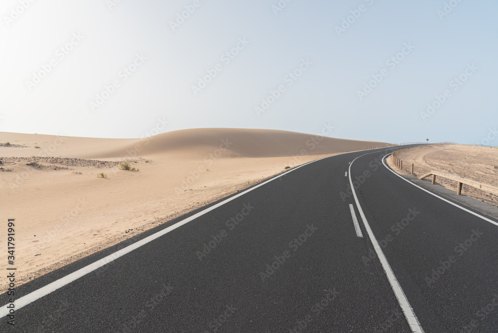road in the desert dunes