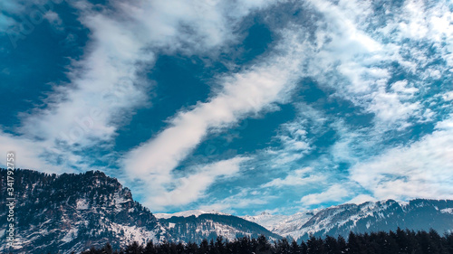 snow mountains surrounded with clouds  photo