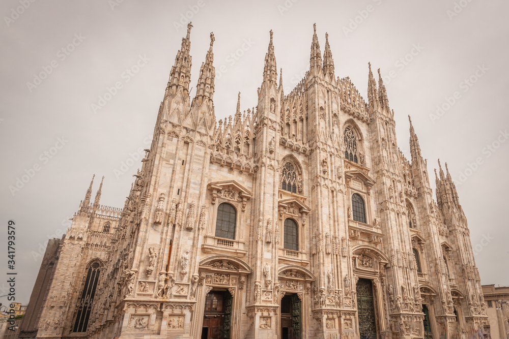 Milan, Italy, April 2020, Front of the Duomo (Milan Cathedral), in downtown of the city closed , empty of people during covid19 Coronavirus epidemic