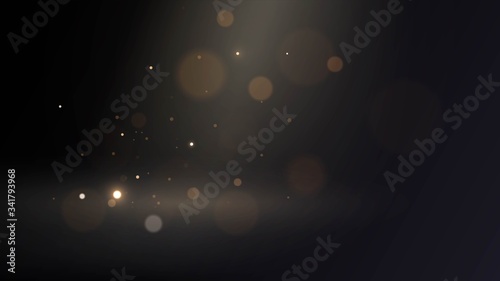 Golden little sparkles with blur effect in dark space, gold bokeh sand