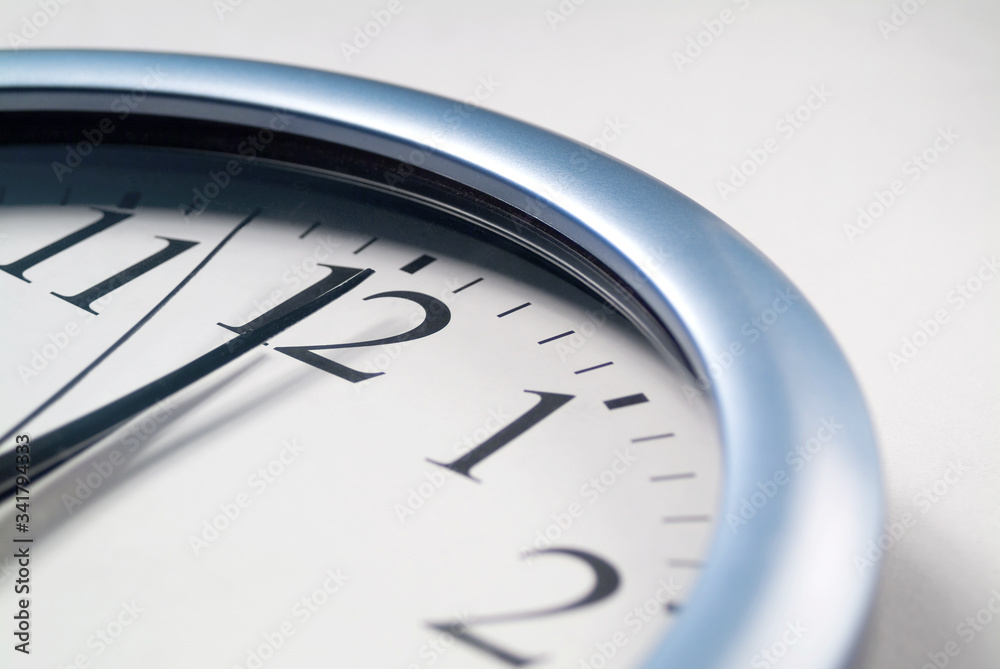 A close up of an analog clock displaying 12 o clock. A close up of an analog clock displaying 12 o clock.