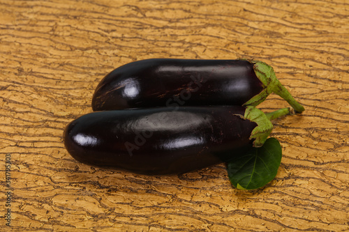 Ripe tasty Eggplant over wooden background