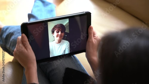 Top view of woman calling a friend for video chat and talk. Stay home concept. Pandemic virus disease coronavirus covid 19. Connect with people at home with technology and smartphone.