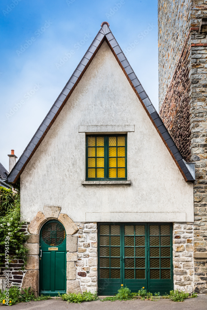 Tiny house entry with green door and windows Tiny house entry with green door and windows